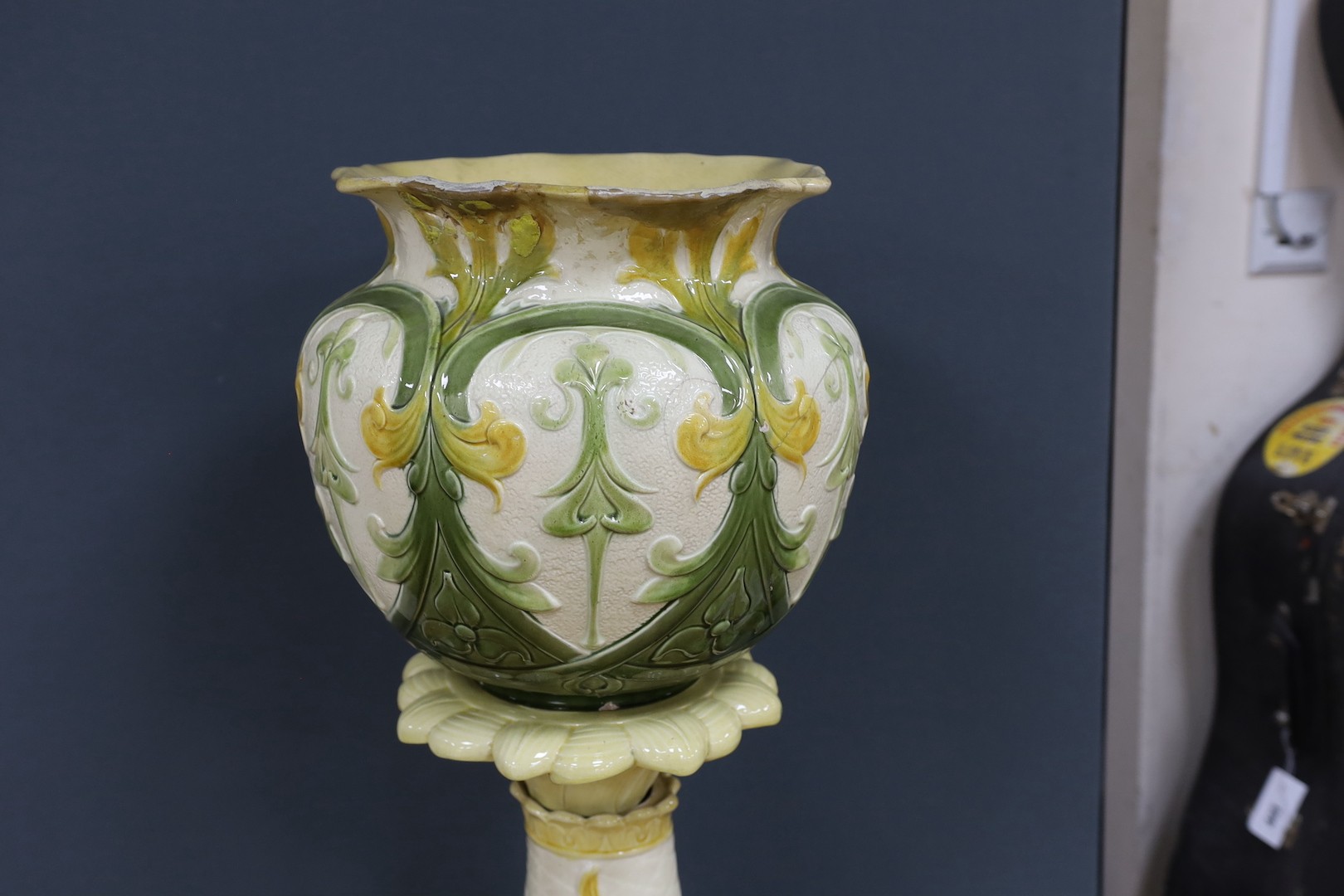 A Leeds Art pottery floral jardinière, on rearing dolphin pedestal - 114cm high